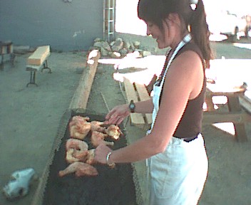 Picture of Karen grilling dinner